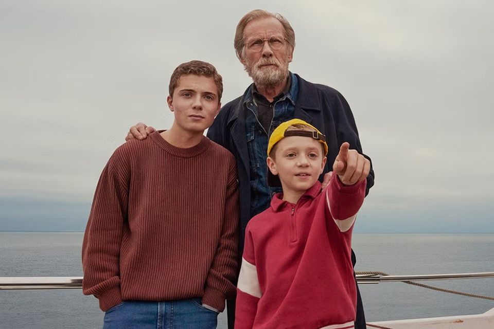 Bill Nighy with young actors Roman Griffin Davis and Dexter Sol Ansell in '500 Miles'.